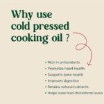 Amrutva Cold Pressed Groundnut and Sesame Oil Combo. This image shows two bottles of cold pressed oil; one groundnut and one sesame; alongside raw ingredients.