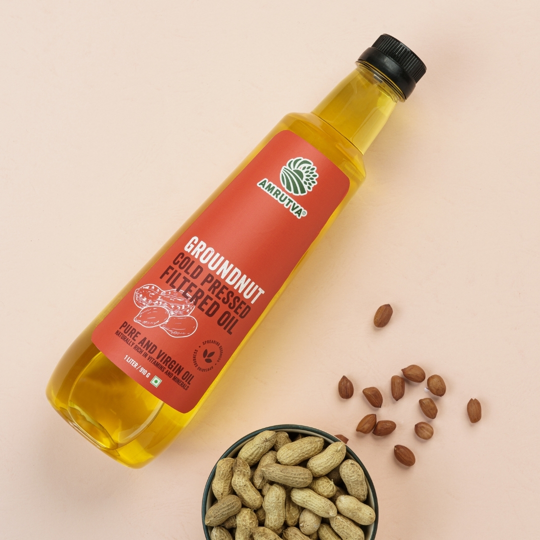 Amrutva Cold Pressed Groundnut Oil made with premium Indian peanuts using traditional wooden kolhus/chekku. This groundnut oil is natural; pure; and perfect for cooking with peanuts shown